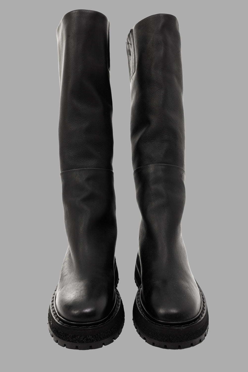 Marsèll women’s knee-high boots in black, front view, rounded toe and thick layered midsole
