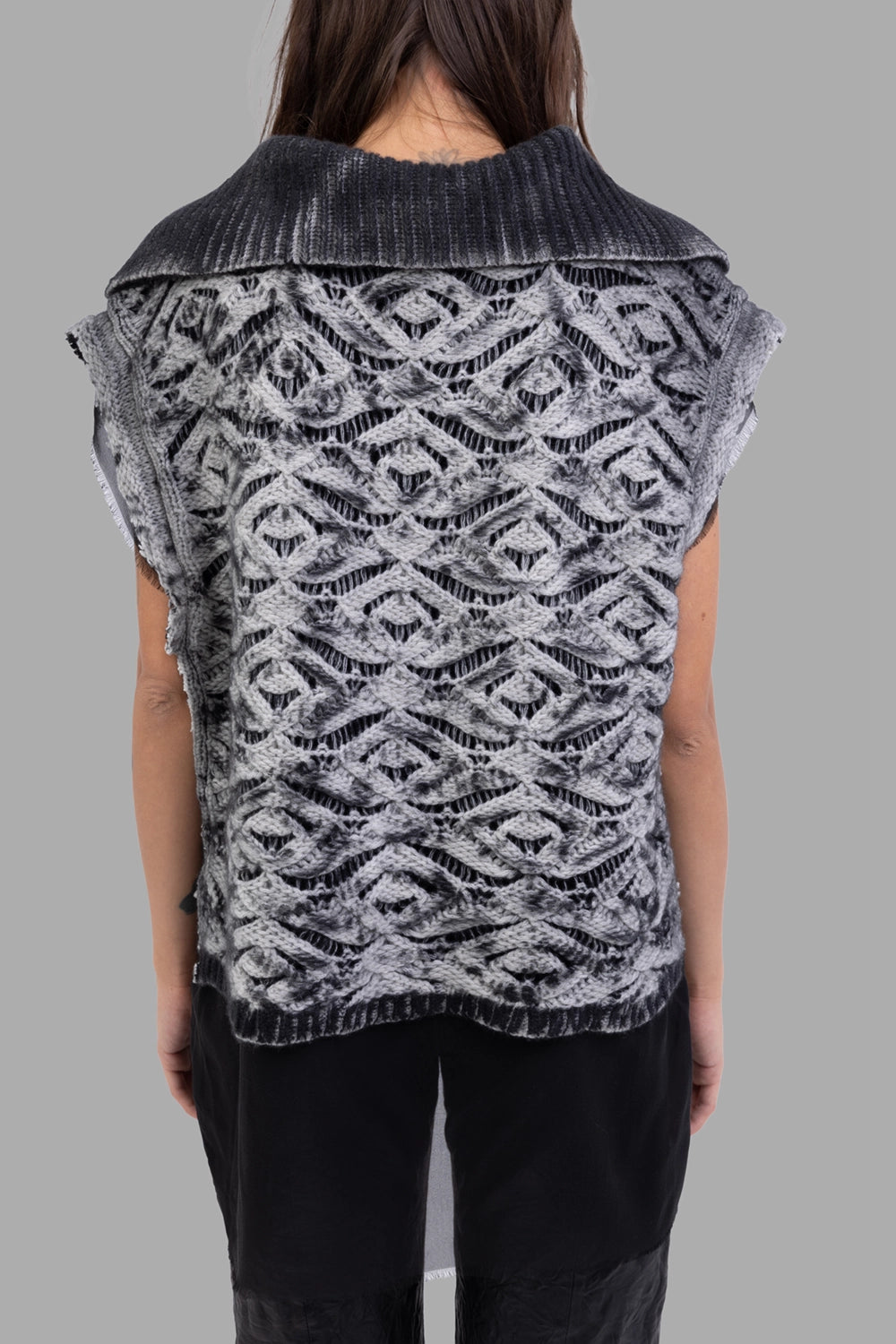 Giovanni Cavagna women knit poncho in black, back view, wide collar and ribbed hem with airy lace knit.