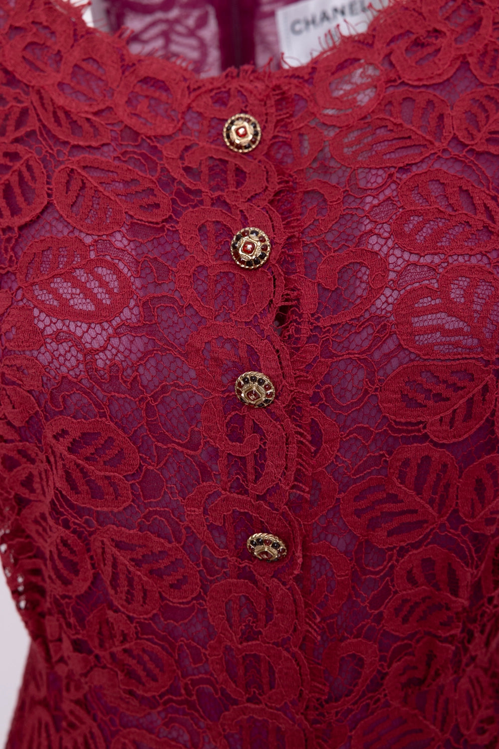 Pre-owned Chanel women's lace dress in burgundy, button detail, gold-tone logo buttons on floral lace.