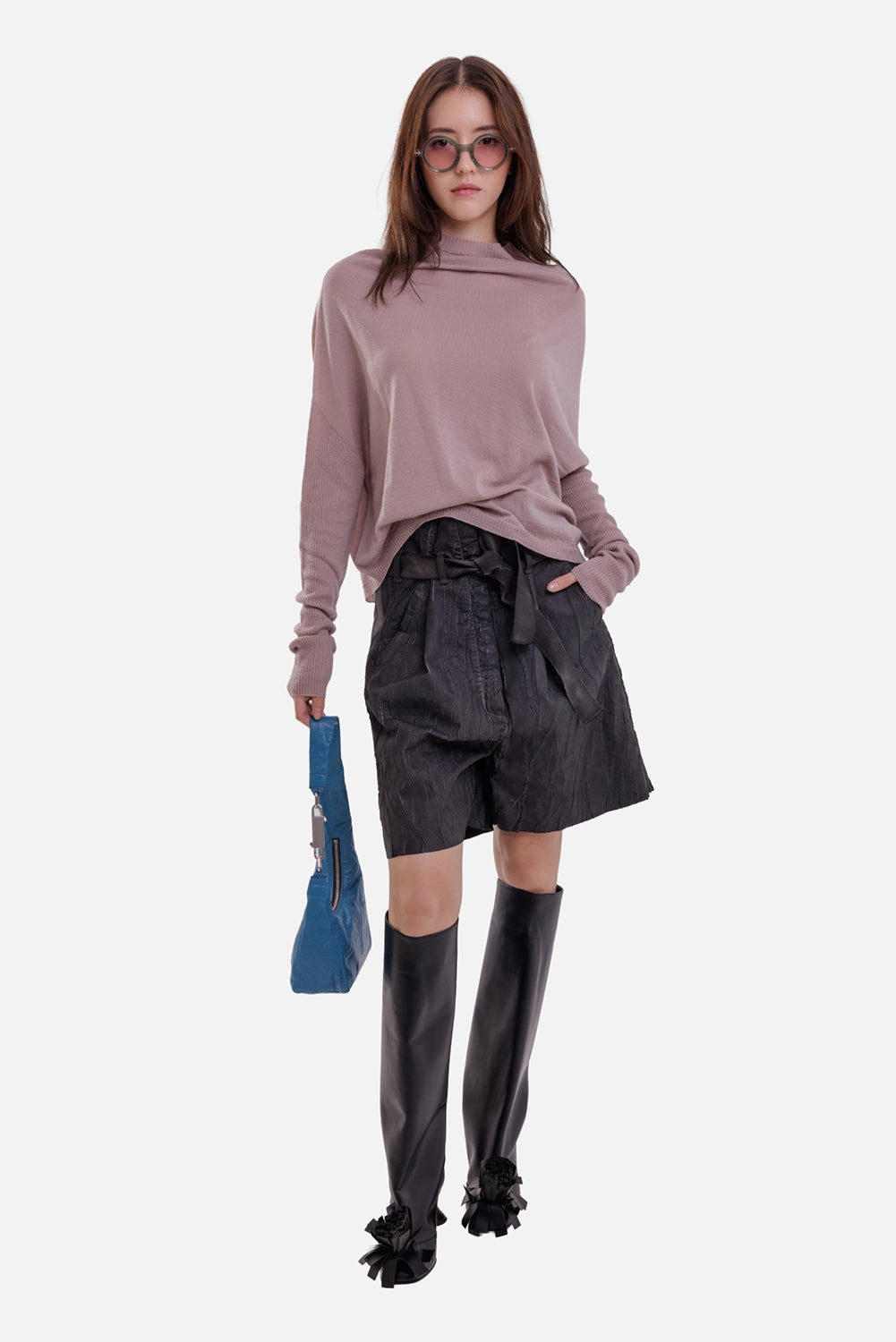 Isaac Sellam Experience women's black leather Bermuda shorts, full-length view with paperbag waist and tie belt