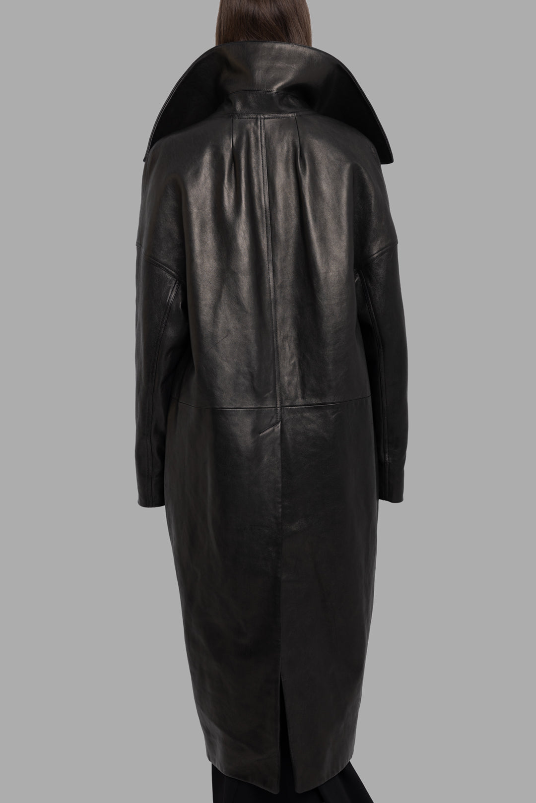 Rick Owens women's black lamb leather Dracucollar coat, back view with high standing collar and longline vented hem