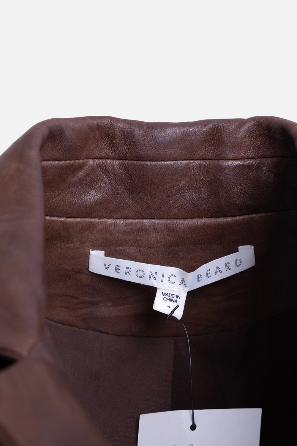 Pre-owned Veronica Beard women's leather jumpsuit in brown, label detail view, Veronica Beard interior tag