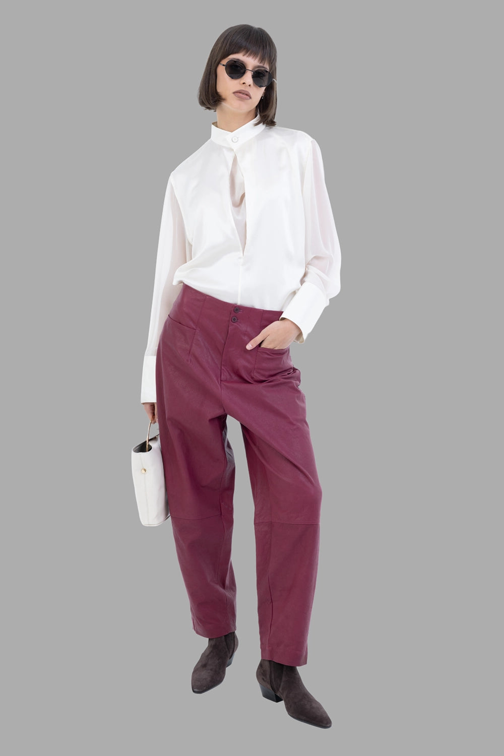 GentryPortofino women's leather trousers in Borgogna, full-length on model, high waist, double-button and relaxed leg.
