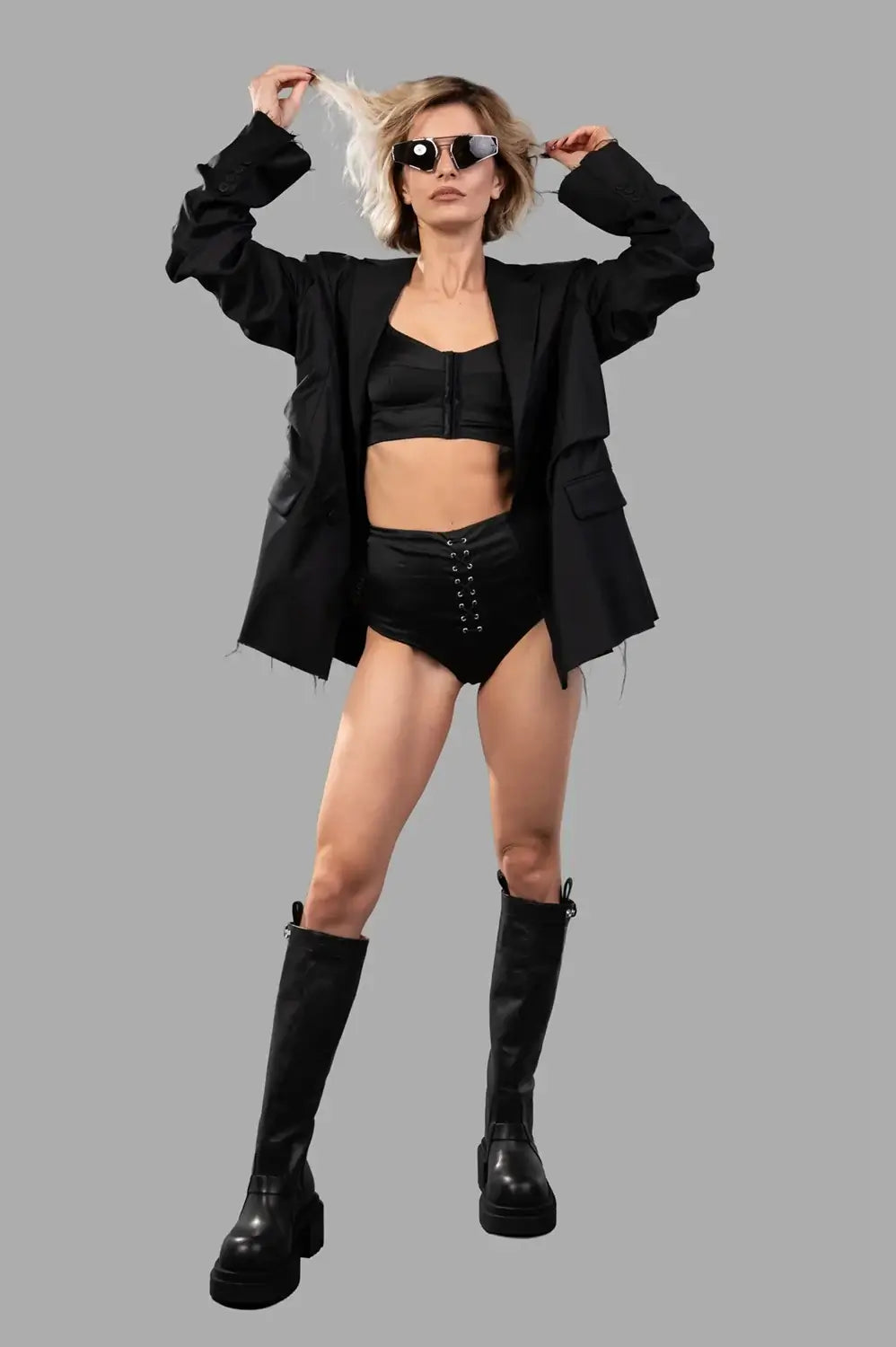 Sehnsucht Atelier lingerie set in black, on-model full length with front lace-up briefs and front-closure bralette