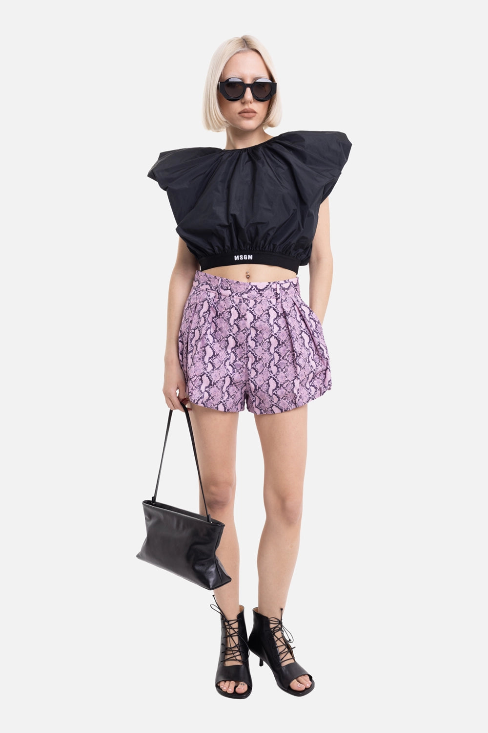 MSGM women's taffeta top in black, on-model full-length with cropped logo hem and balloon volume
