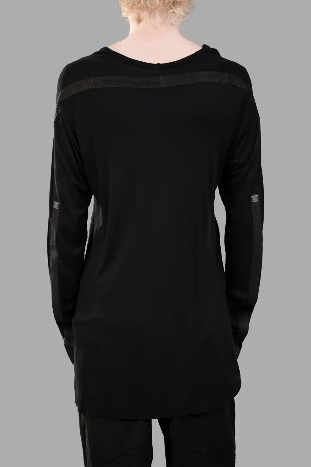 69 by Isaac Sellam long-sleeve t-shirt in black, back view, horizontal leather spines and staple tabs