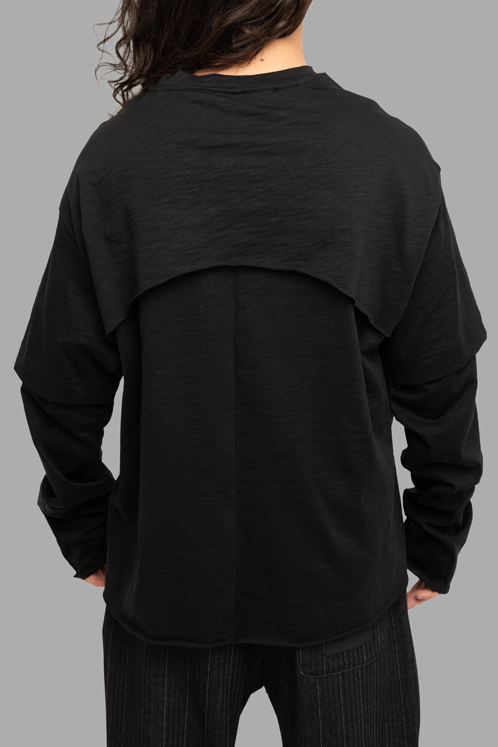 Justin Gall men’s long-sleeve tee in black, back view, large yoke overlay and center seam
