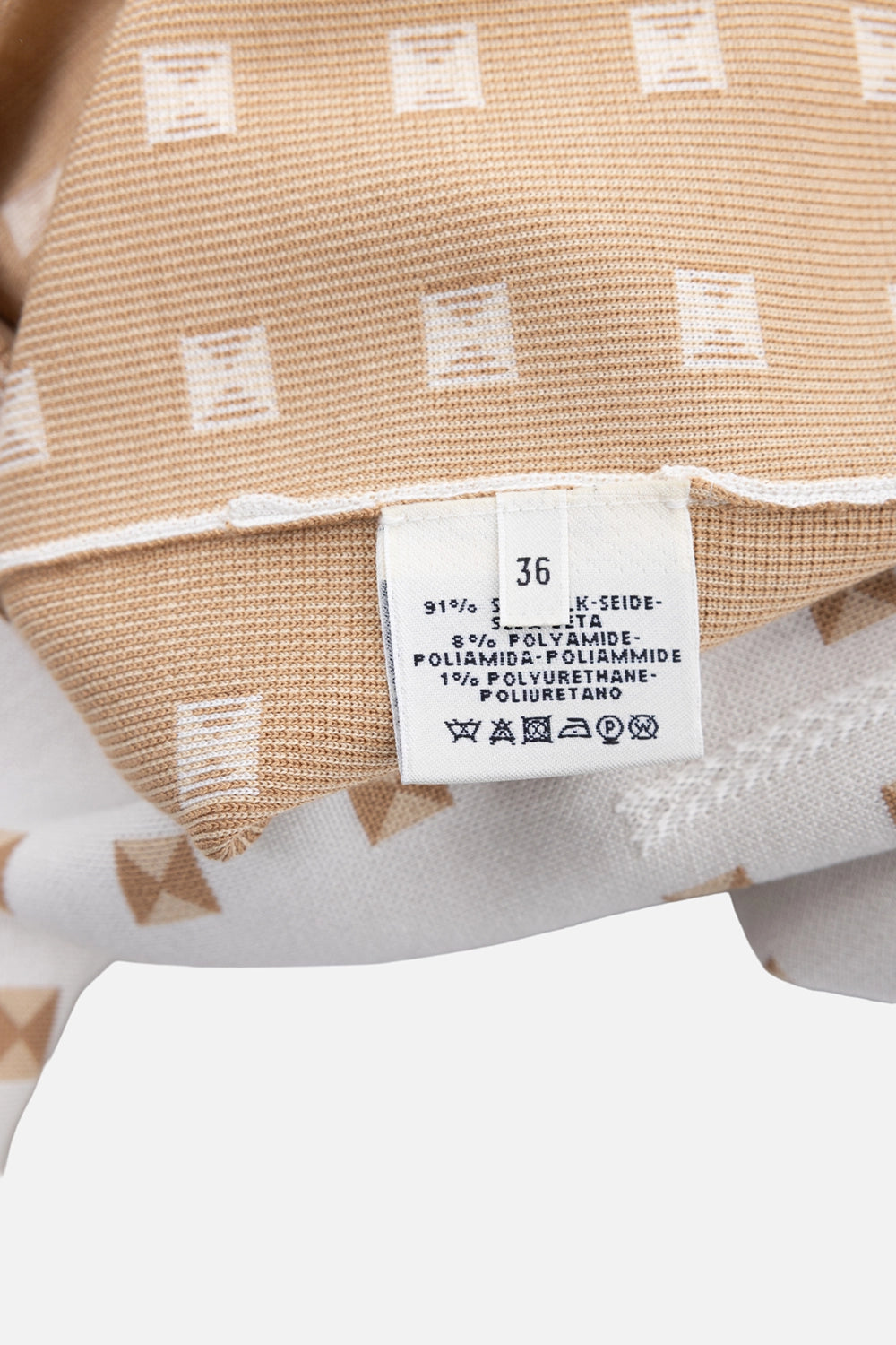 Pre-owned Hermès women's long vest in white/tan, care tag close-up, size 36 label