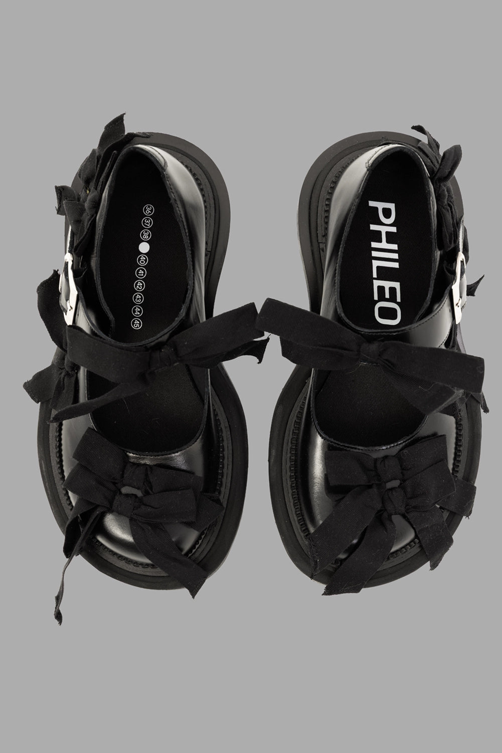 PHILEO women Mary Jane shoes in black, top view, ribbon bows across vamp and strap.