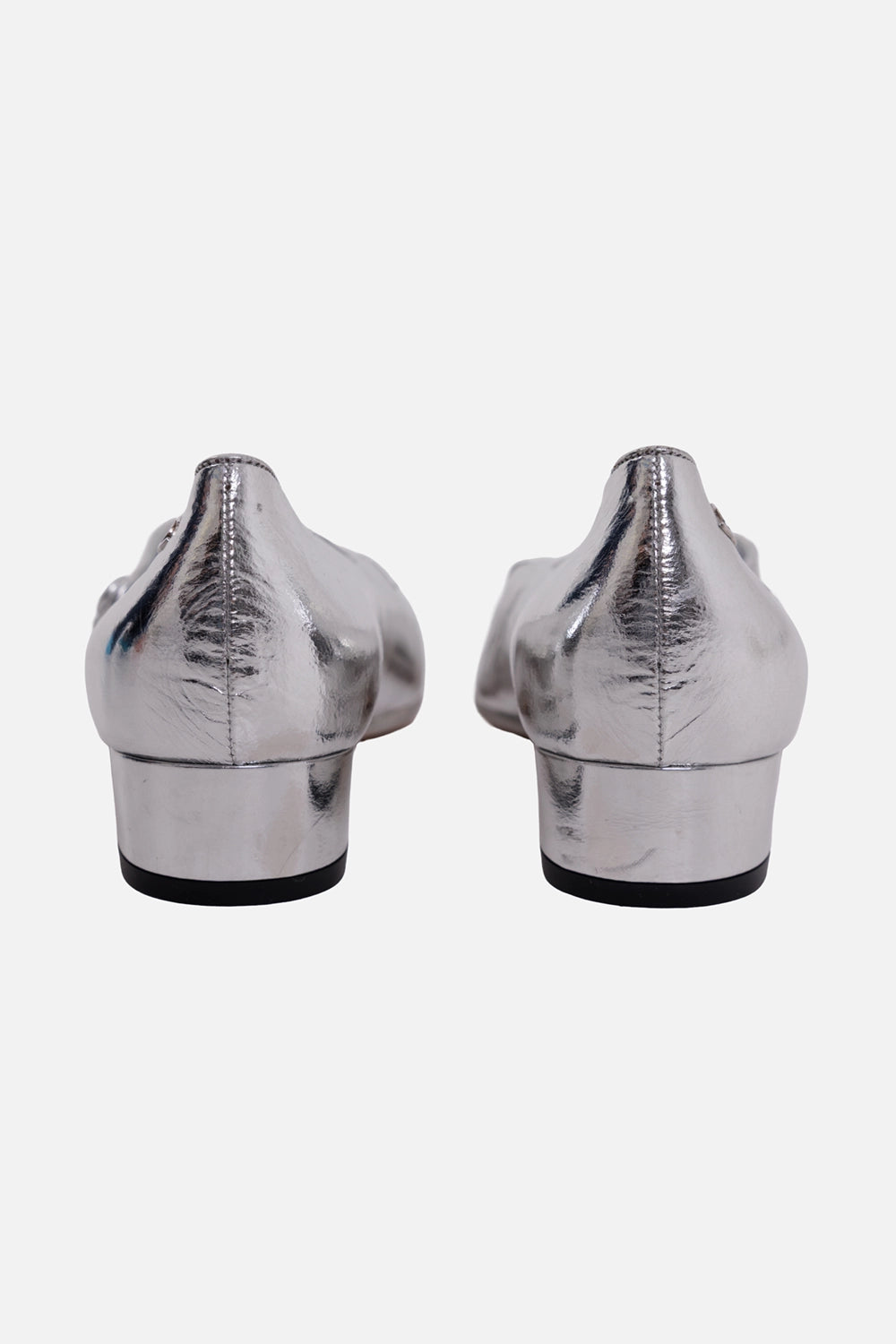 Chanel women's Mary Jane flats in silver, back view, low block heels and small CC logos