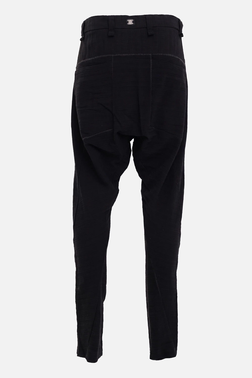69 by Isaac Sellam men's Micro Ondes trousers in Noir, back view with deep patch pockets and steel staple