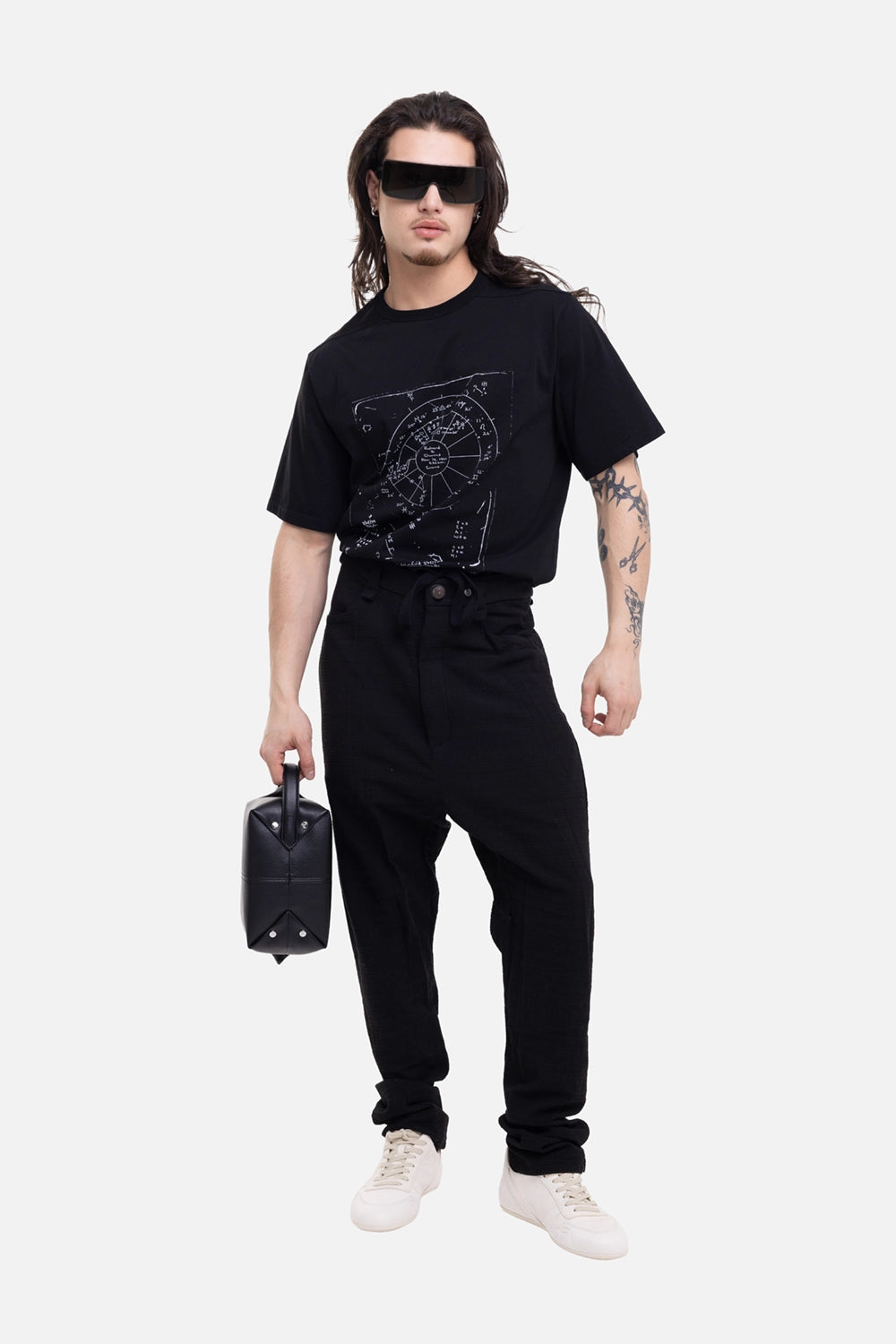 69 by Isaac Sellam men's Micro Ondes trousers in Noir, on-model full-length with low crotch and waist ties