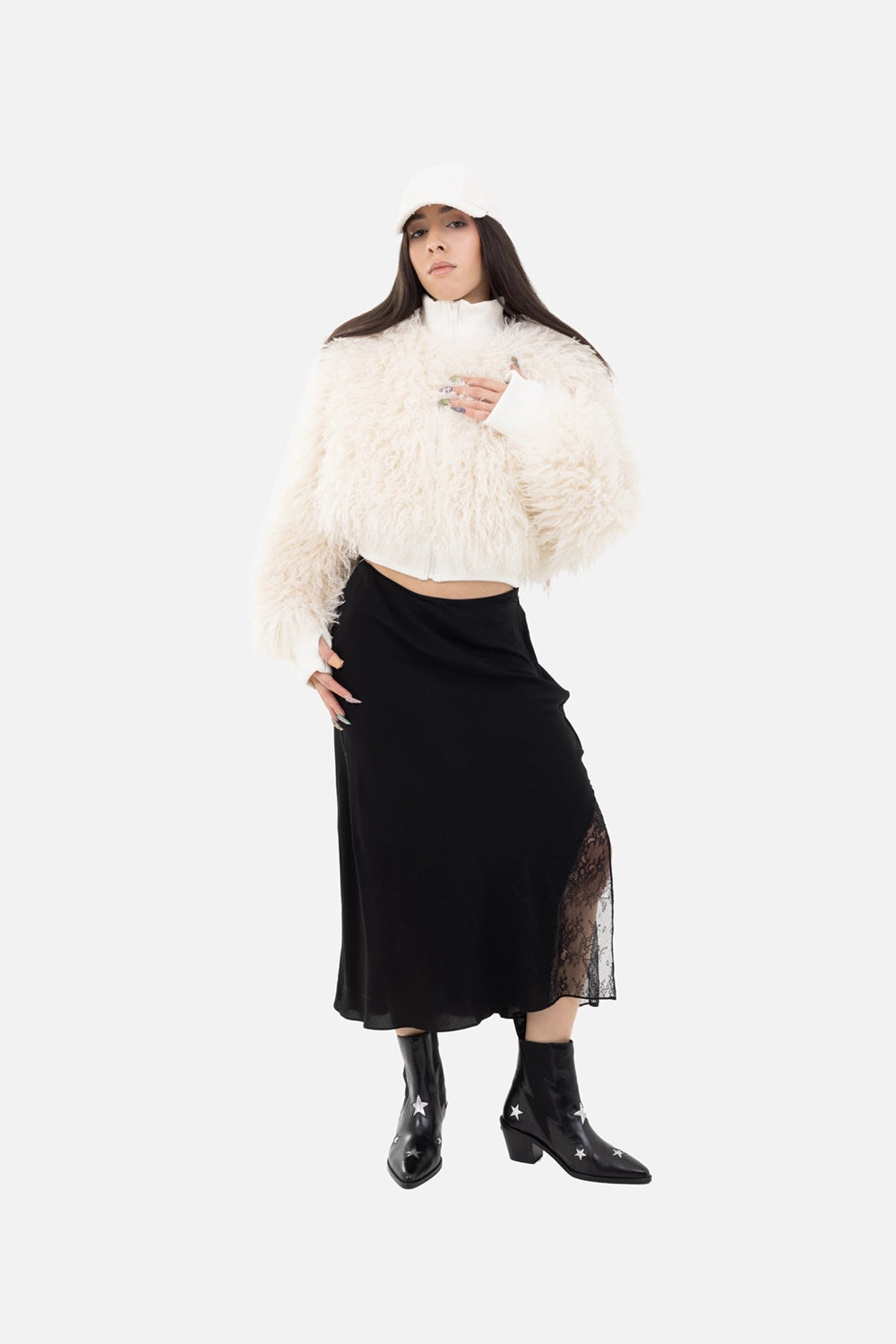 Zadig & Voltaire women's midi skirt in black, on model full length, lace-inset slit showing sheer texture.