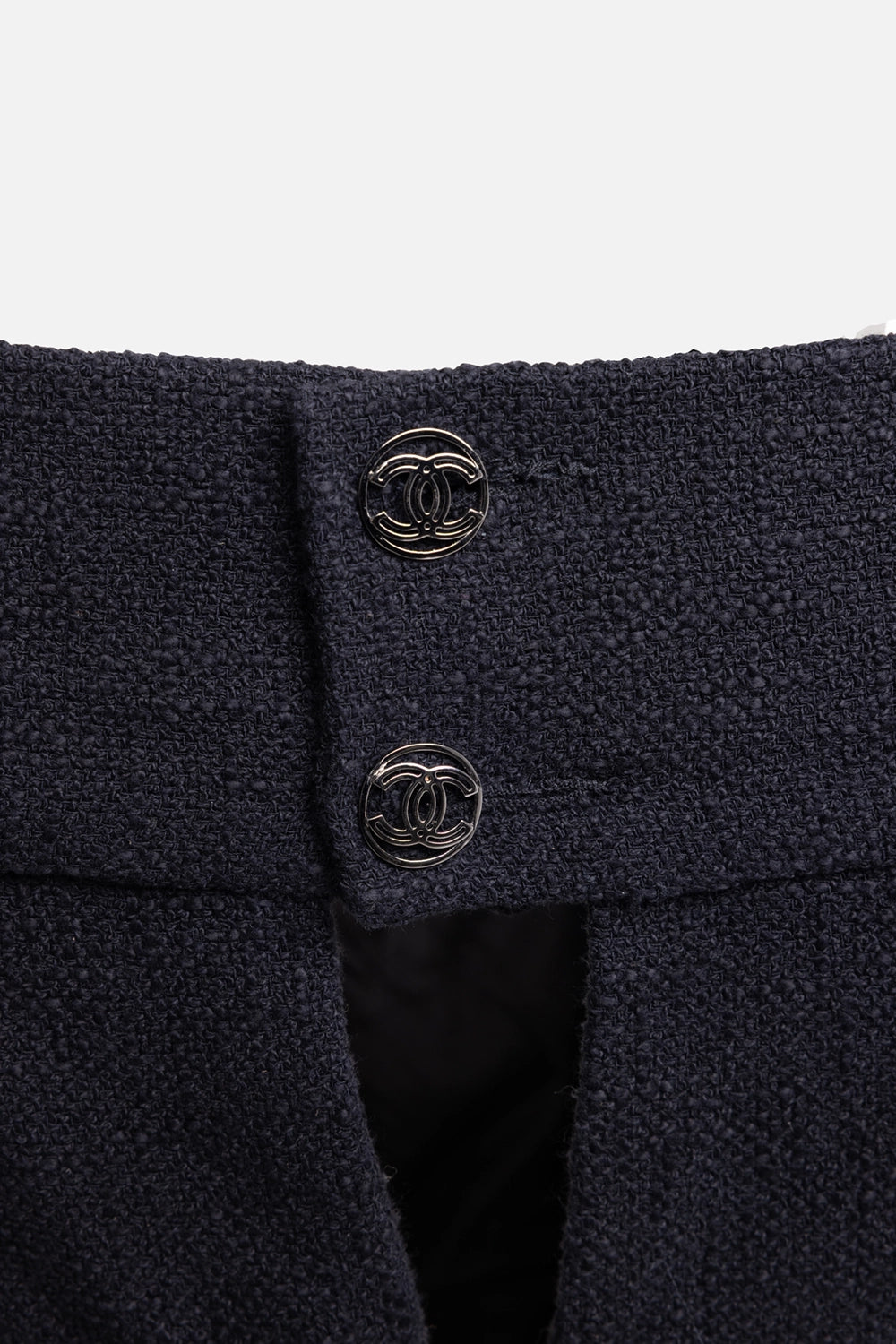 Pre-owned Chanel mini dress in black, hardware close-up, CC logo buttons on textured cotton