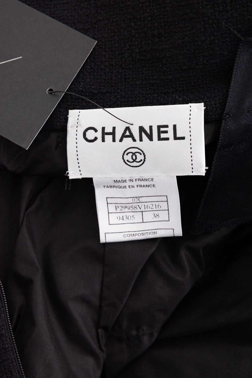 Pre-owned Chanel mini dress in black, label view, brand label with season code and size