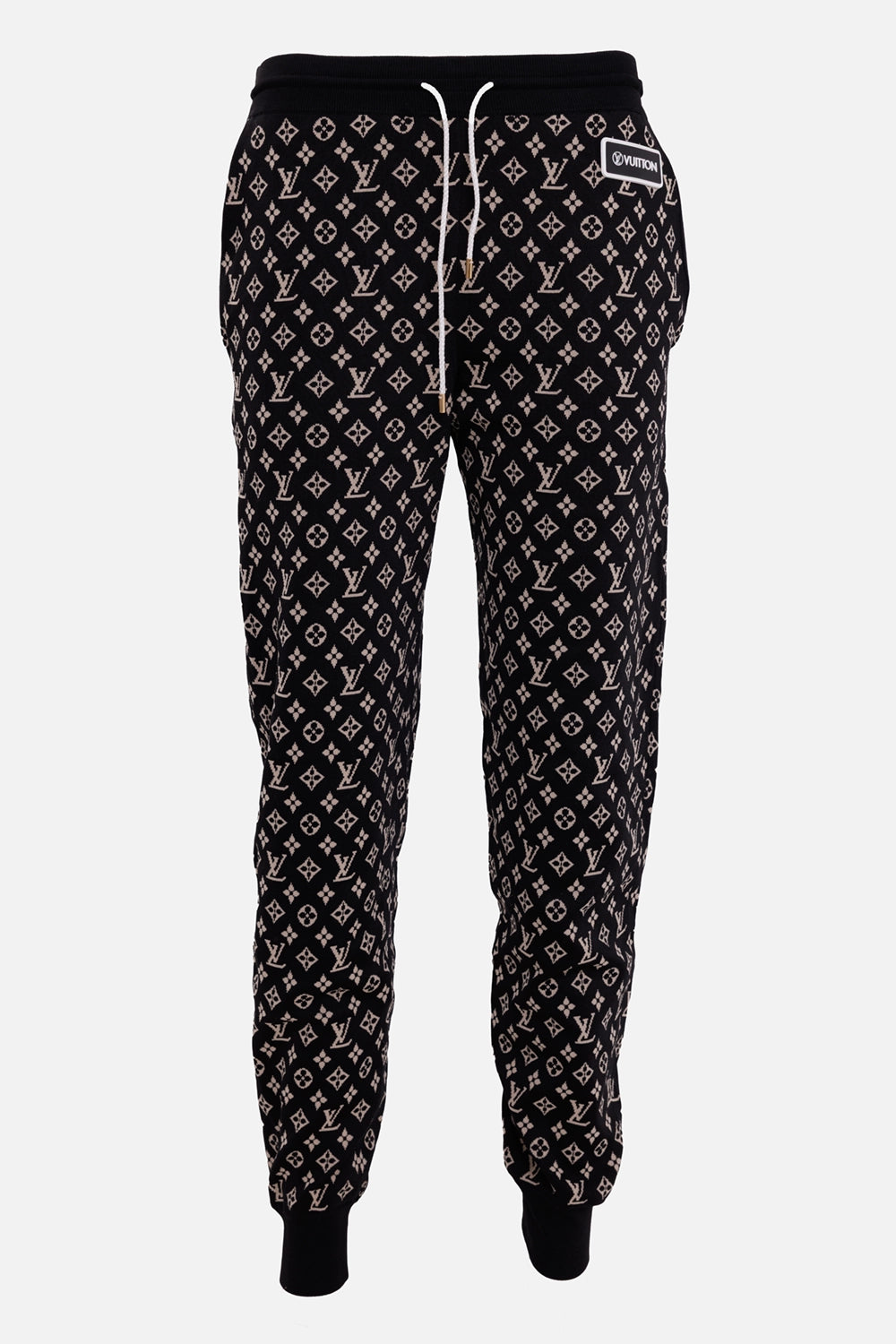 Louis Vuitton women's jogging pants in black and camel, front view with white drawstrings and ribbed cuffs