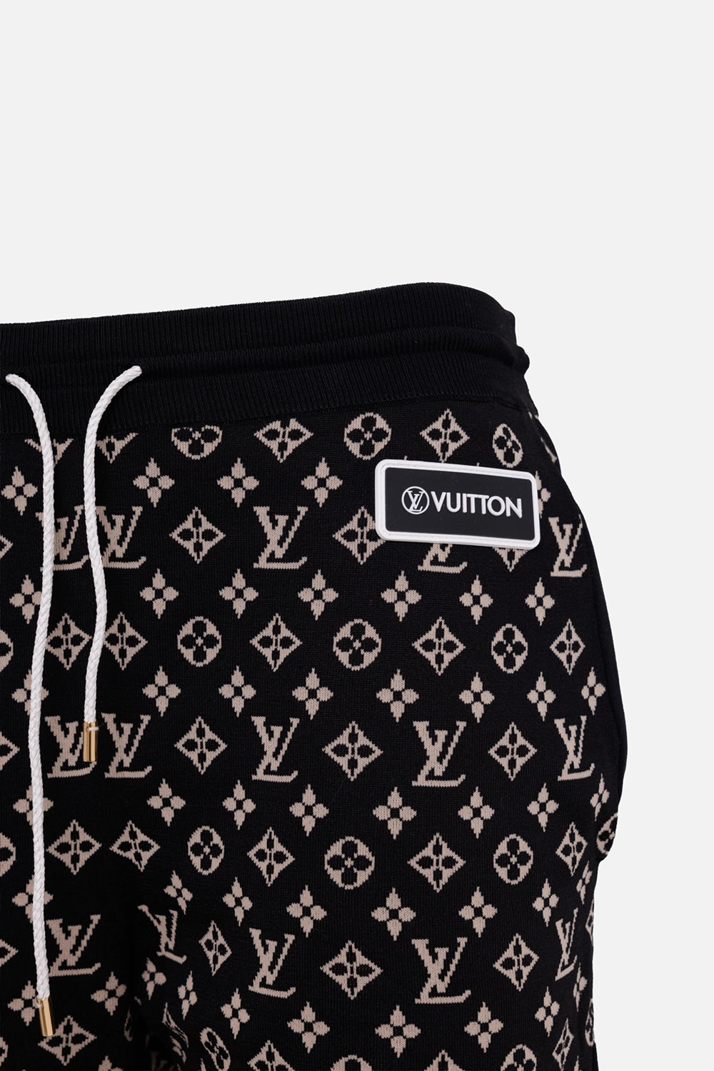 Louis Vuitton women's jogging pants in black and camel, logo detail with LV Circle patch and white drawcord
