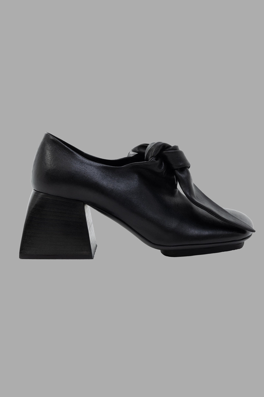 Uma Wang women mules in black, side view, square toe and sculpted block heel with knotted vamp.