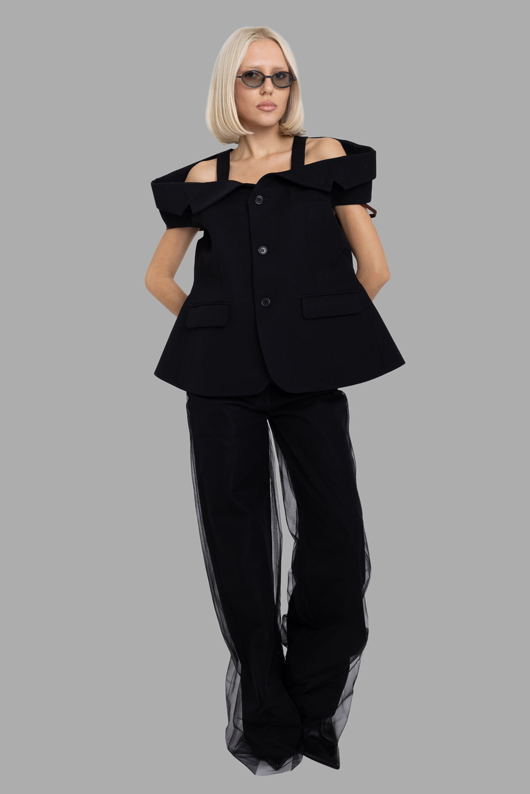 Noir Kei Ninomiya women's black off-shoulder wool blazer, on-model full length, wide A-line shape with folded neckline
