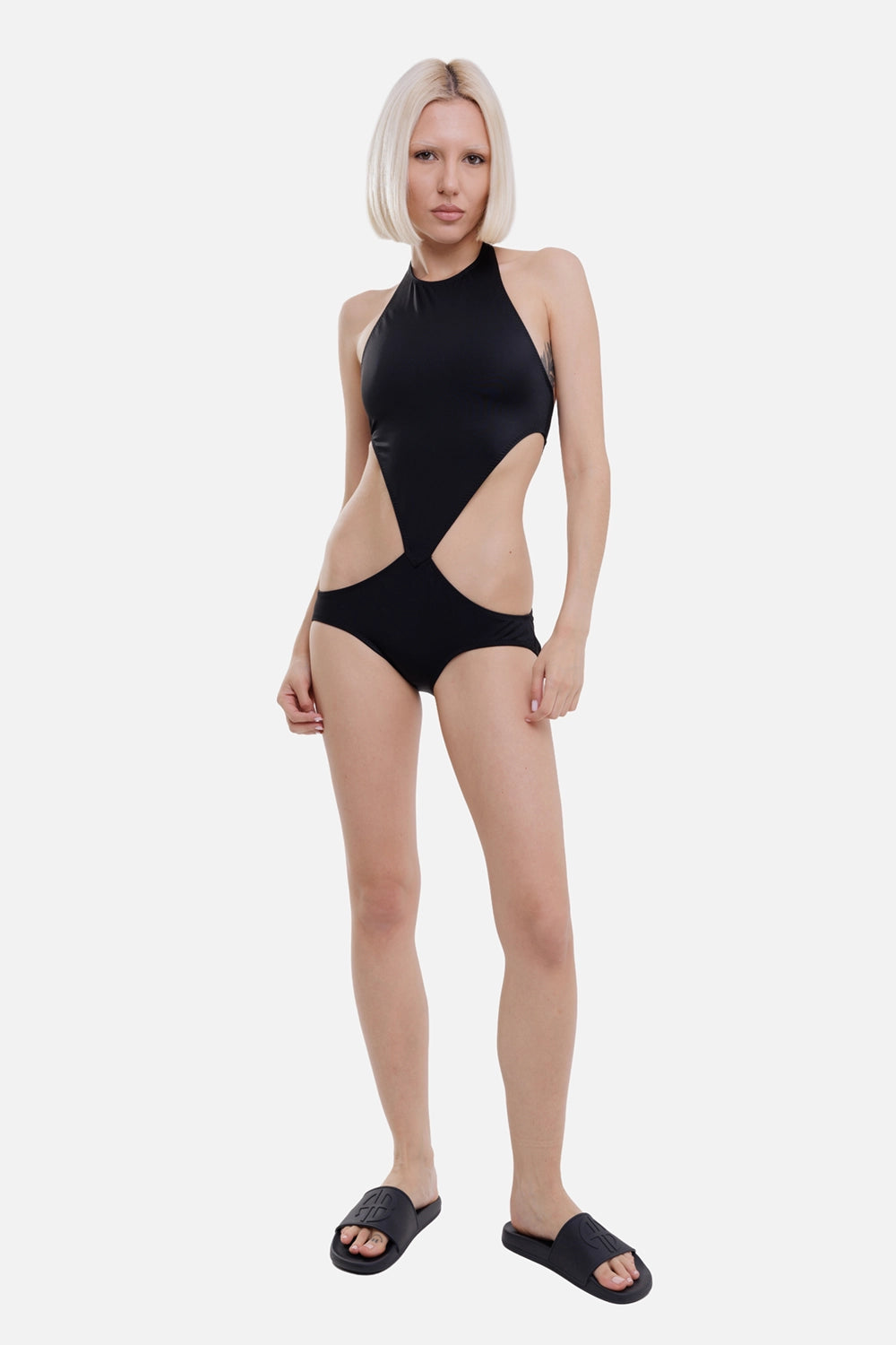 Norma Kamali women's one-piece swimsuit in Black, on-model full length, sculpted cutout waist