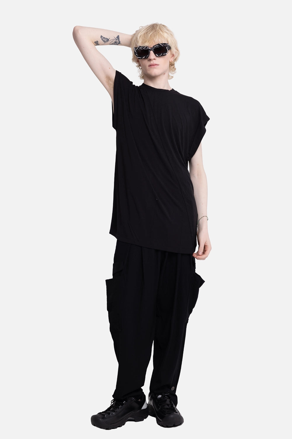 La Haine Inside Us men's over trousers in black, on-model full-length with relaxed legs and side cargo pockets
