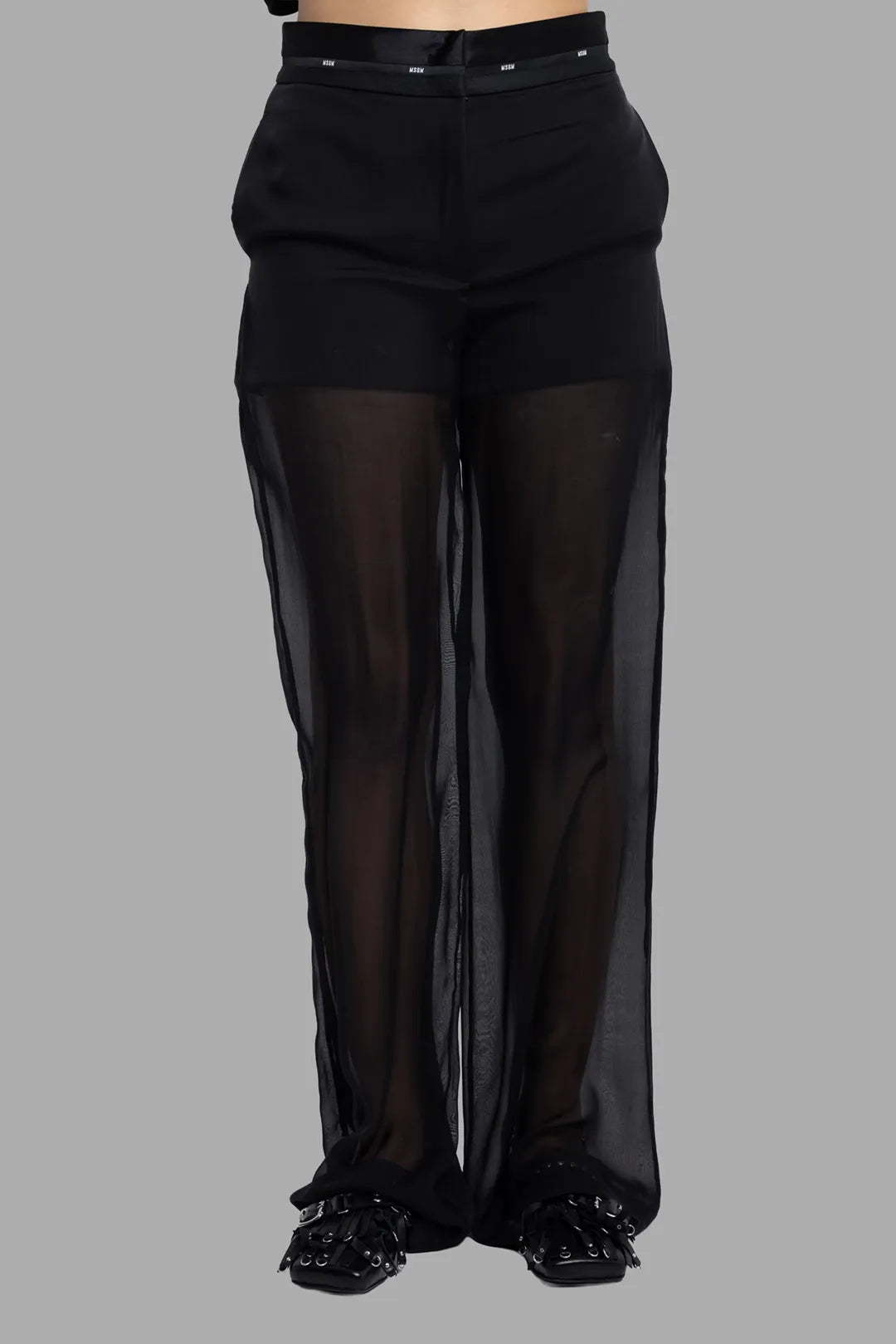 MSGM women's black sheer overlay pants, front view focusing on inner shorts and semi-transparent wide legs