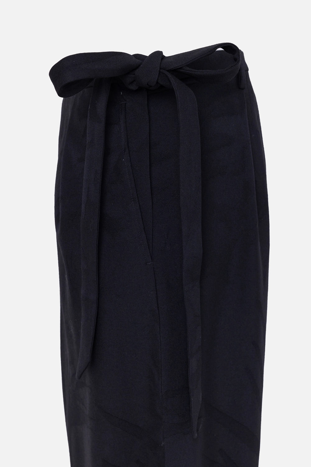 Pre-owned Saint Laurent women's pants in black, side view, tapered leg with long waist tie straps