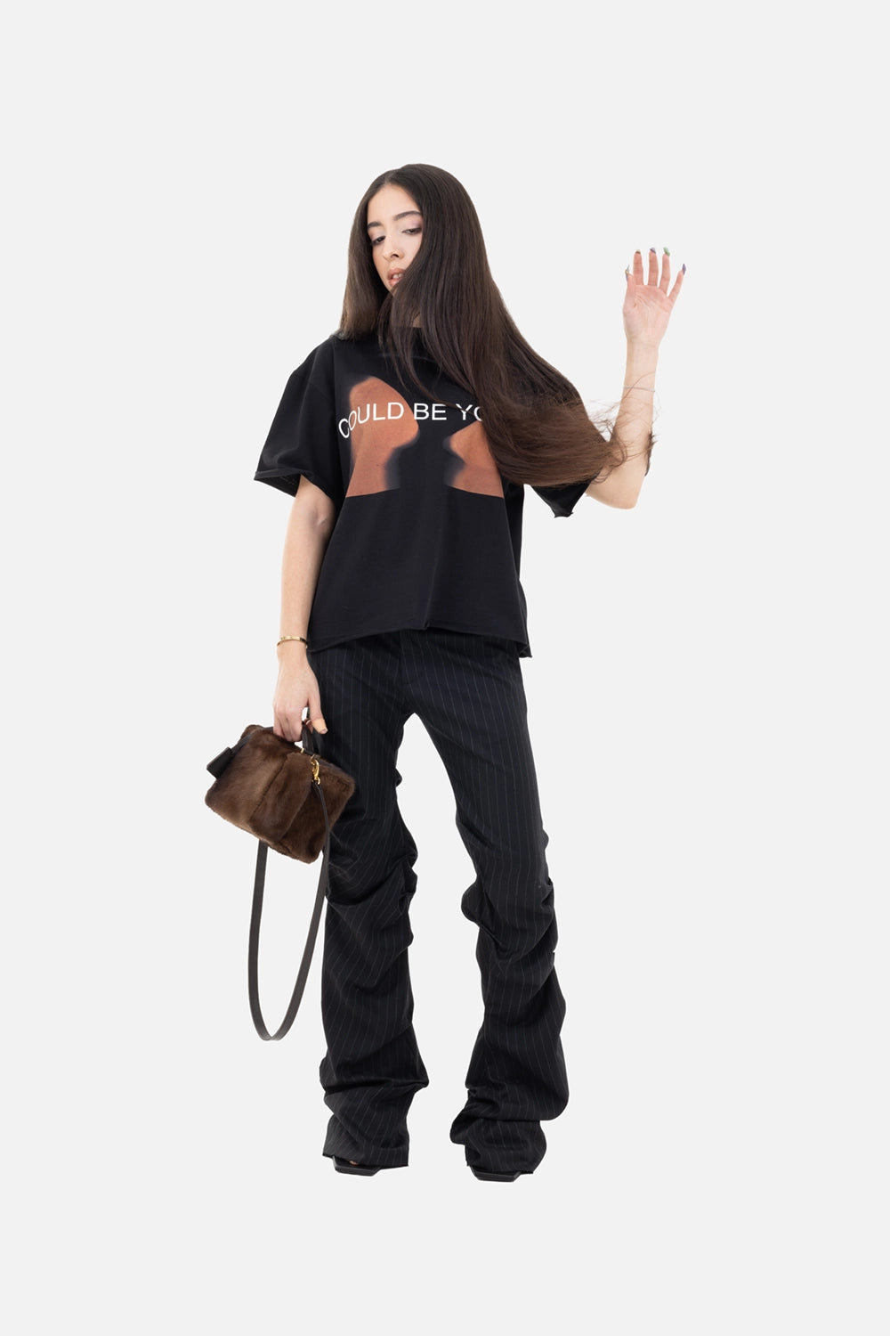 Natasha Zinko women's pinstripe pants in black/white, on-model full length, elongated stacked hems.