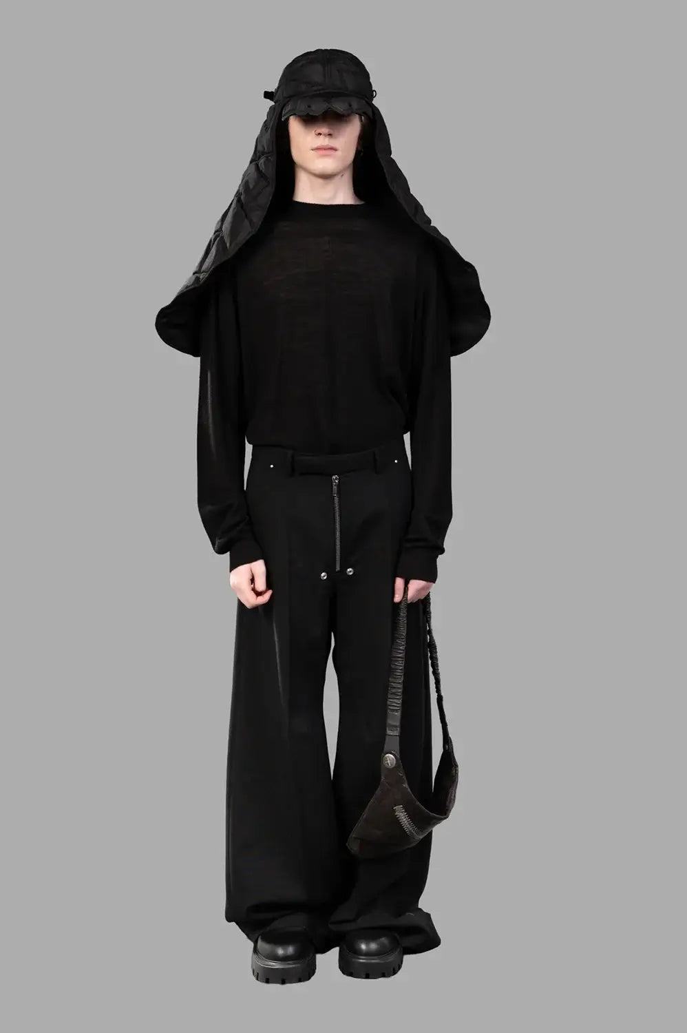 Rick Owens wide-leg pants in black wool‑blend, on‑model full length, front pleat and relaxed silhouette