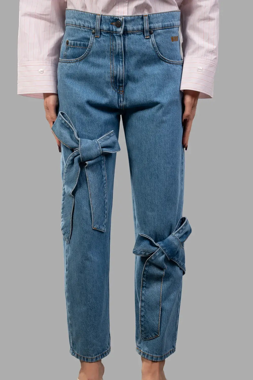 MSGM pants in blue washed denim, front view, five pockets and belt loops visible