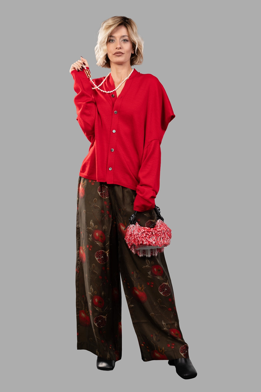 UMA WANG pants in brown/red, on-model full length, pomegranate print and fluid wide leg
