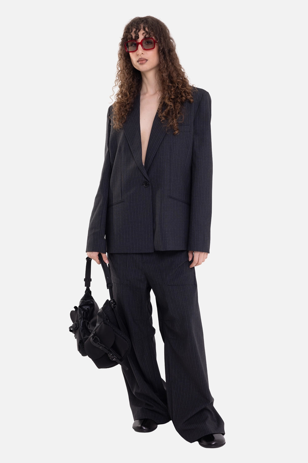 Torishéju women's blazer in black, on-model full-length view, one-button front and matching pinstripe trousers