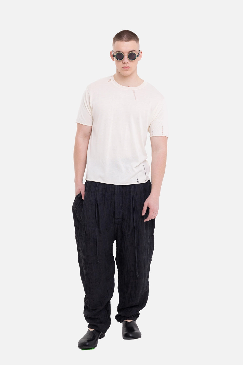Marc Point men's trousers in black, on-model full-length view with relaxed tapered leg and high waist