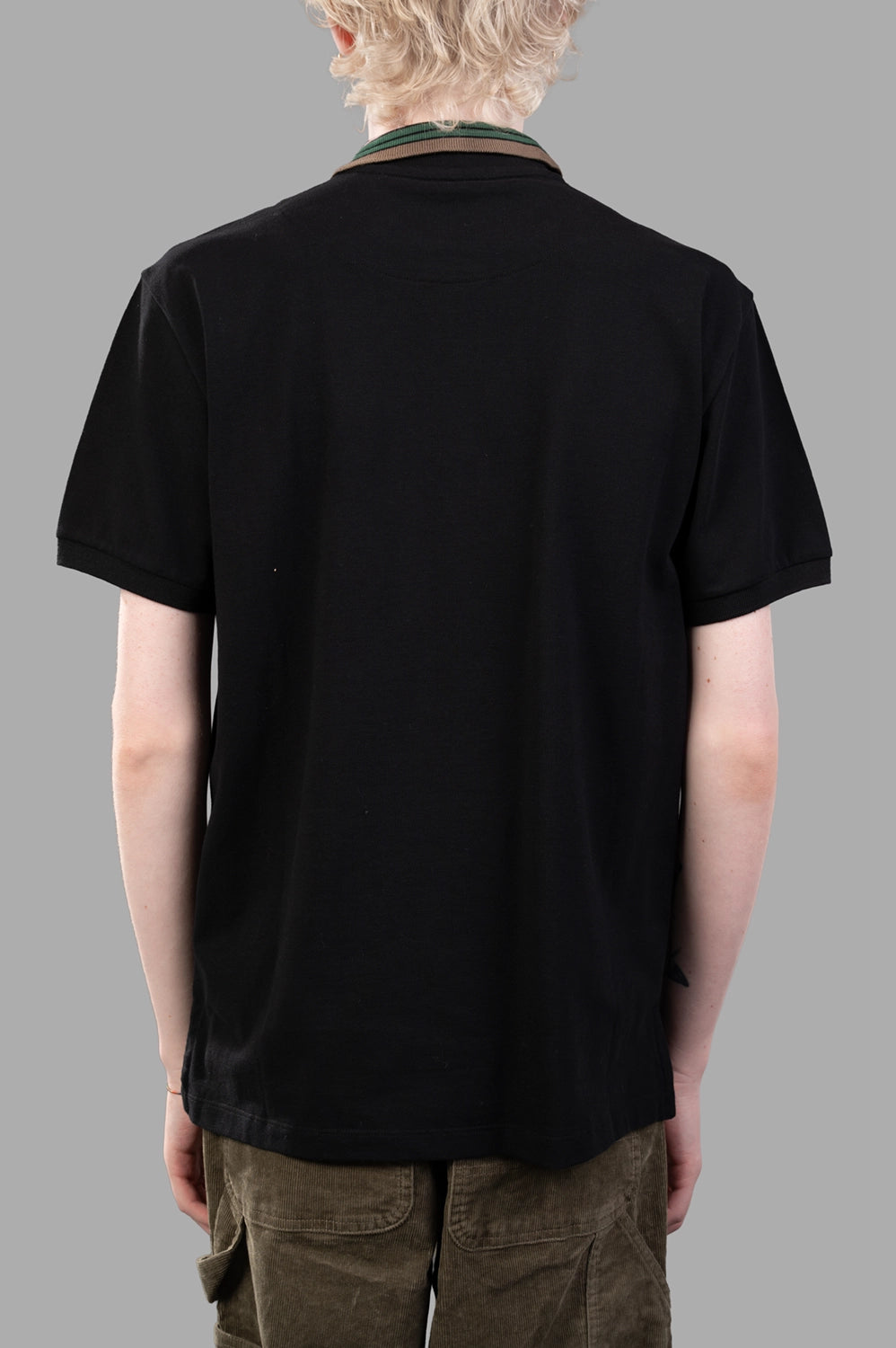Vivienne Westwood polo shirt in black, back view, striped rib collar and curved hem