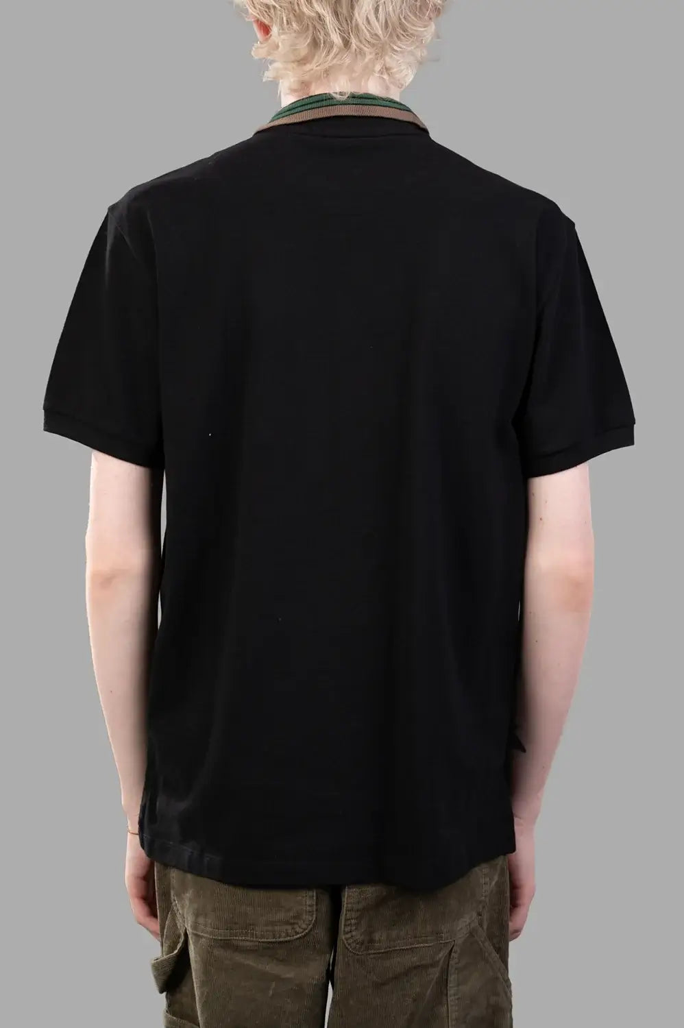 Vivienne Westwood polo shirt in black, back view, striped rib collar and curved hem
