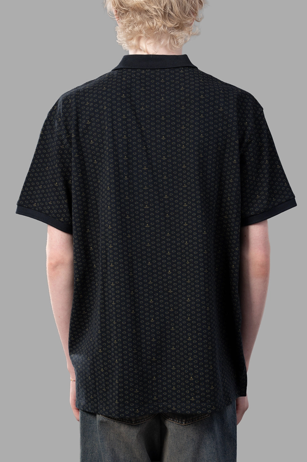 Vivienne Westwood polo shirt in Dots & Orbs, back view, curved hem and continuous micro print