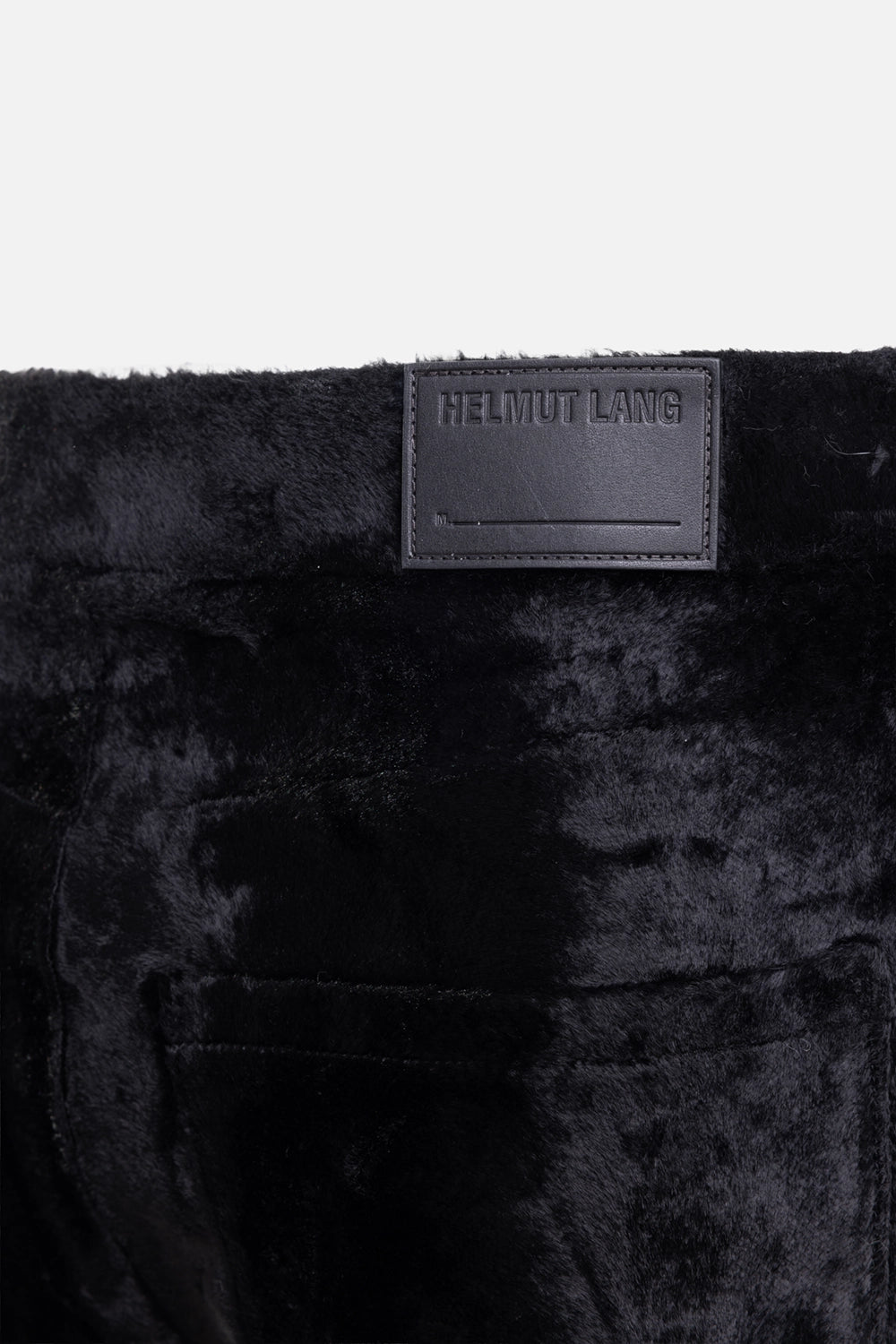 Helmut Lang women's pony-effect pants in black, logo detail, embossed leather patch on plush fabric