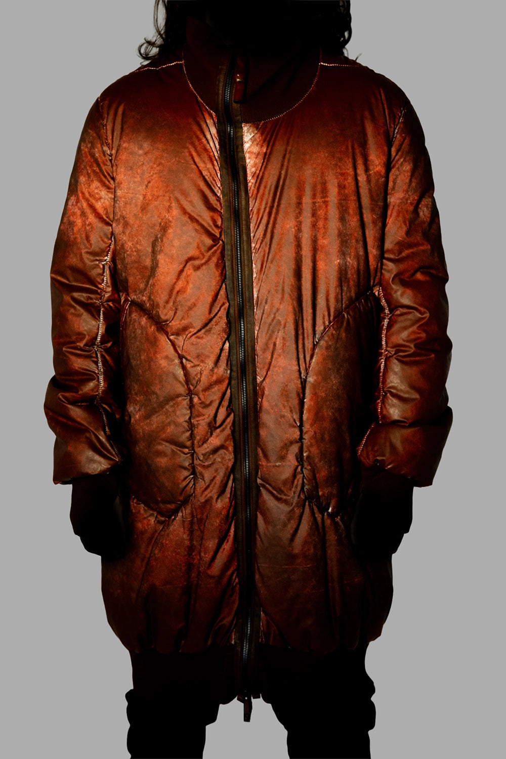 69 by Isaac Sellam men’s puffer coat in Dirty Red, front view, reflective mottled finish under light
