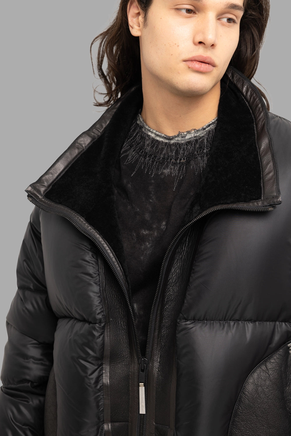 Isaac Sellam Experience unisex puffer coat in noir, collar detail with soft inner pile and leather placket