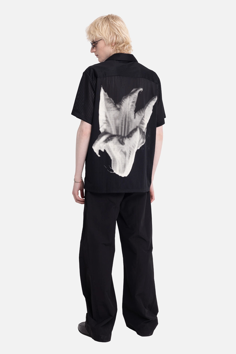 Filling Pieces men's resort shirt in black, on-model back full length, large white flower print
