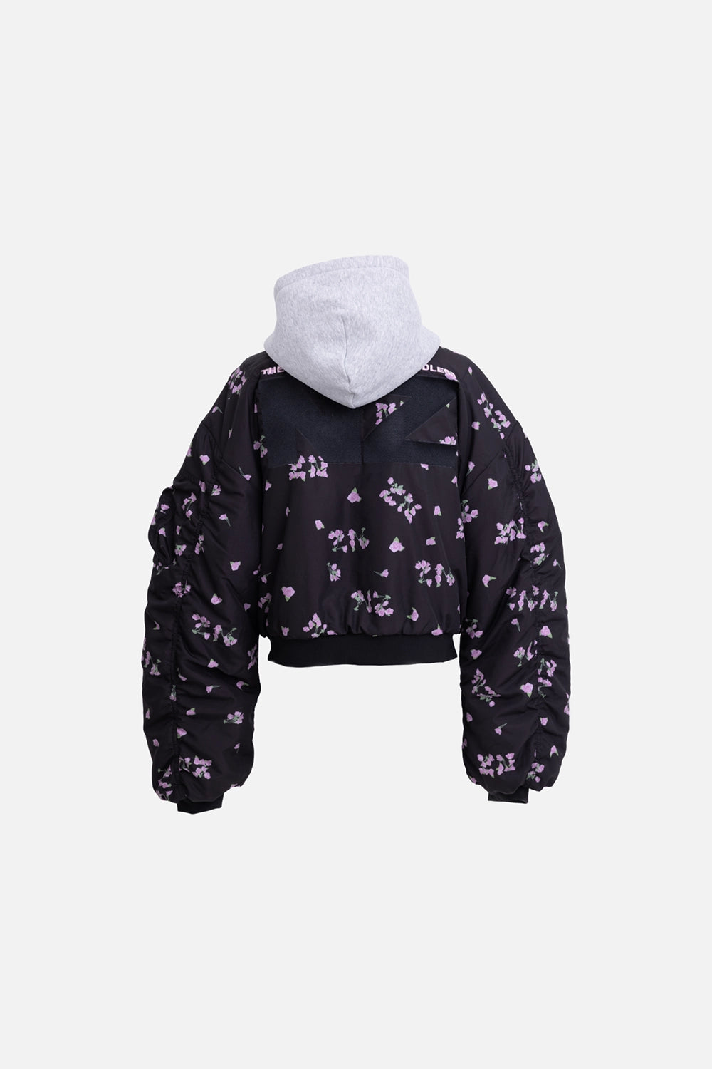 Natasha Zinko reversible bomber jacket in black/grey, back view, grey hood and scattered pink floral print