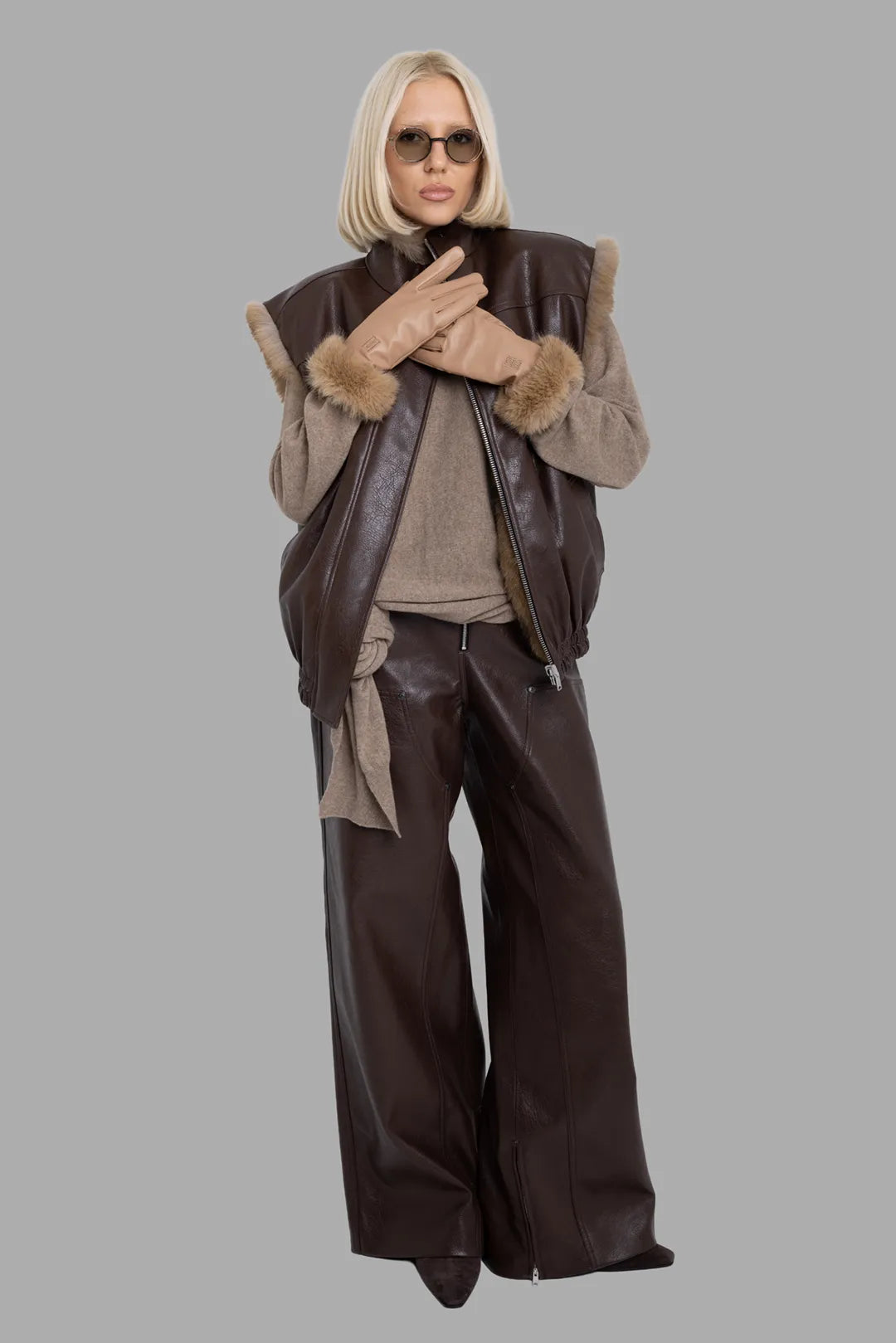 MSGM women's brown reversible faux leather vest, full-length front view on model, fur trim at armholes and elastic hem.