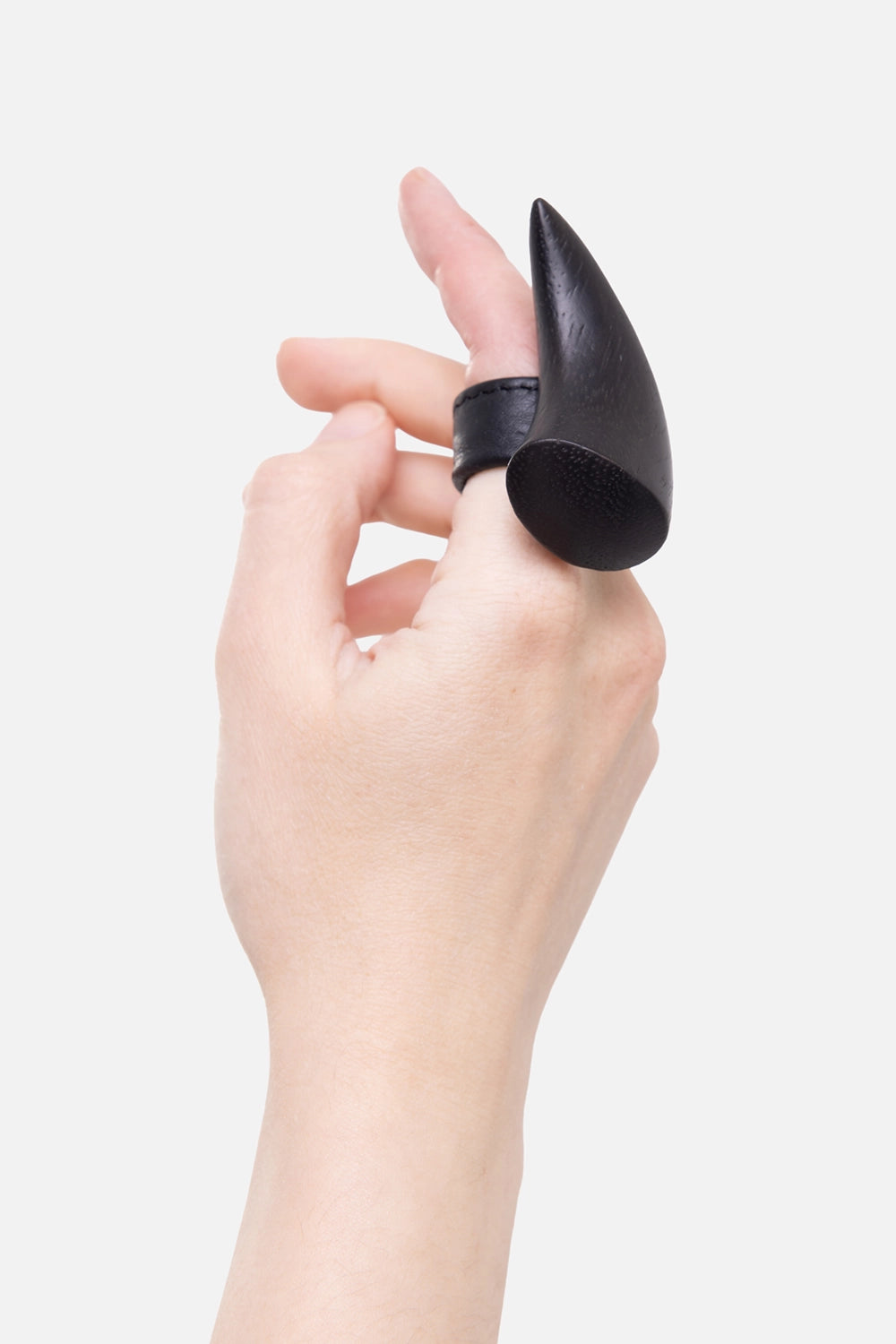 Monies women's ring in black, on-hand side view, raised horn shape on leather band