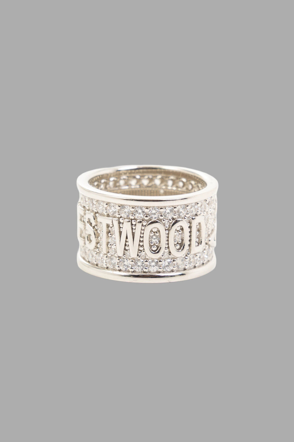 Vivienne Westwood ring in platinum, 3/4 view, VIVIENNE WESTWOOD lettering with pavé surround.