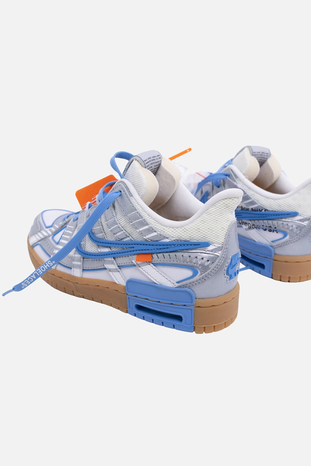 Pre-owned Nike x Off-White unisex Rubber Dunk sneakers in white/blue, angled view, side text print and blue heel block