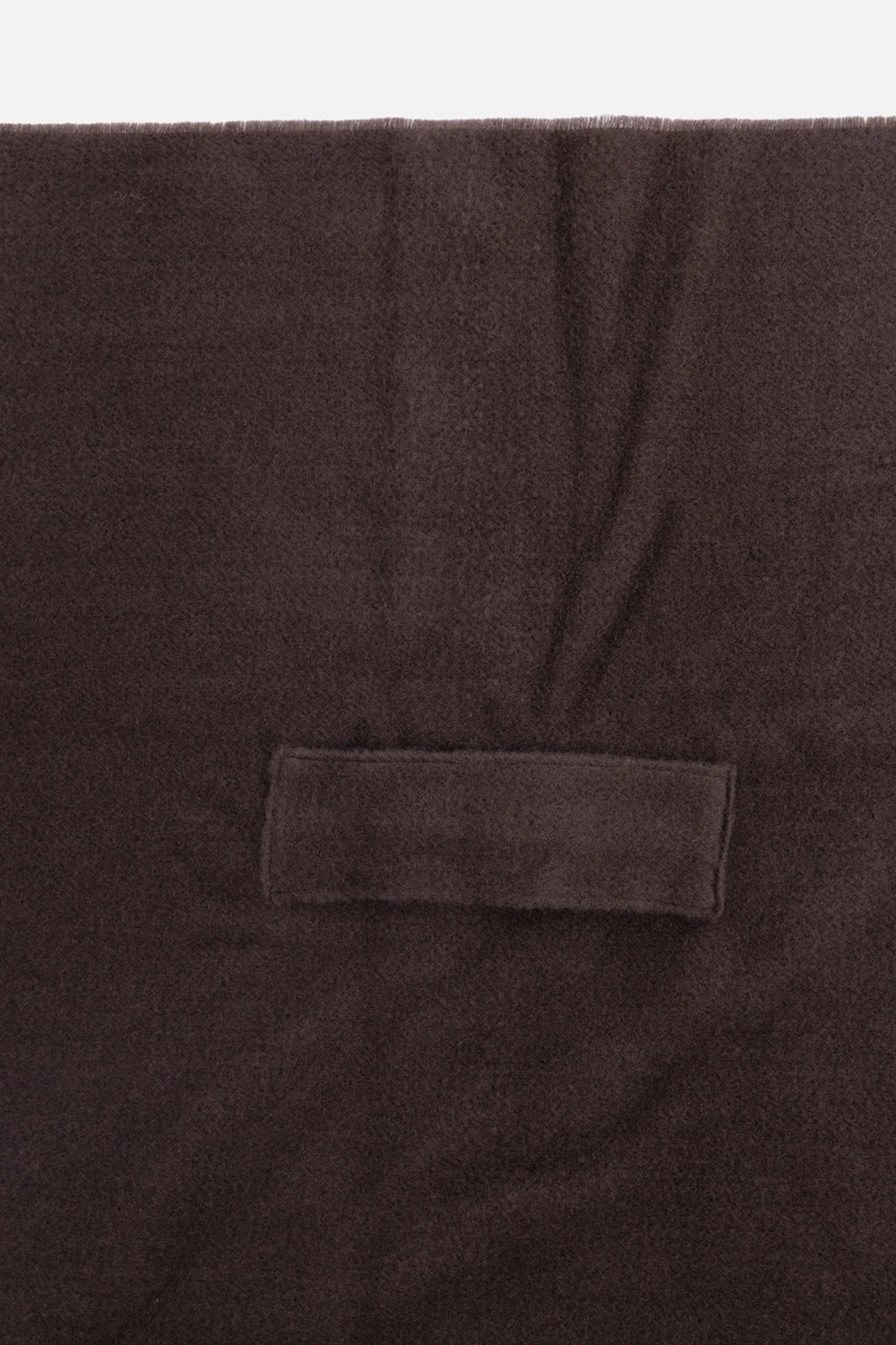 Gentry Portofino unisex scarf in Mastice, close-up showing soft wool texture and tonal rectangular loop