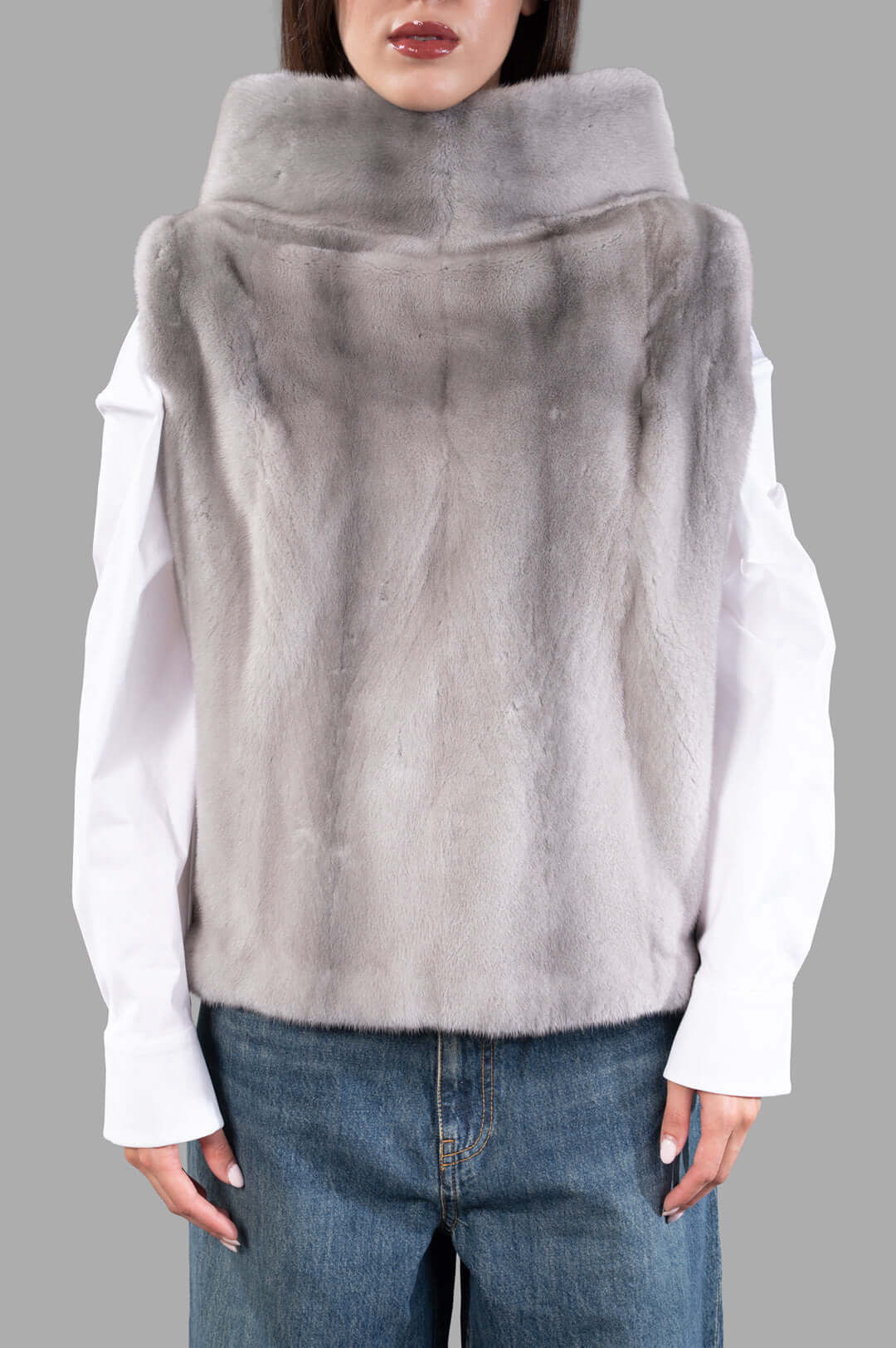 Inès & Maréchal Fur Vest in grey, showcasing luxurious shearling texture and hooded design, perfect for modern layering.