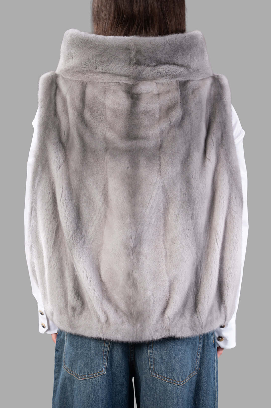 Inès & Maréchal Fur Vest in grey, showcasing soft lambskin and shearling texture from the back for versatile layering.