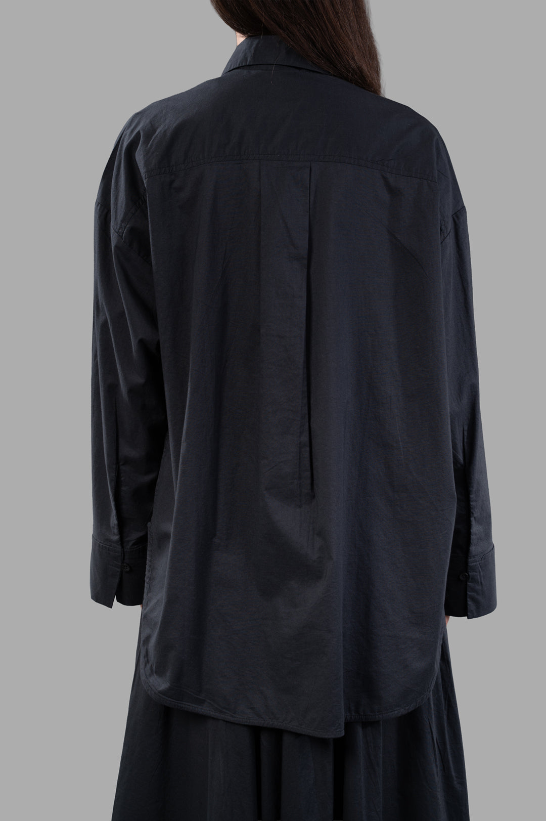 By Malene Birger. Derris Organic Cotton Shirt, black, shown from the back, highlighting its classic smart design and texture.