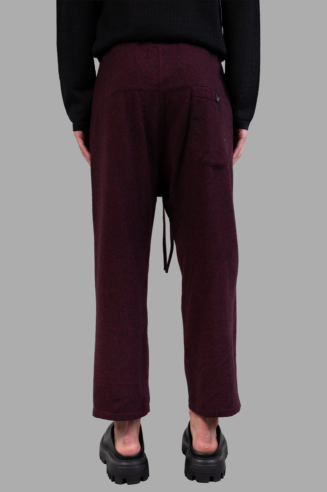 Marc Point Drawstring Trousers in burgundy, featuring a high-rise fit and adjustable waistband, shown from the back.